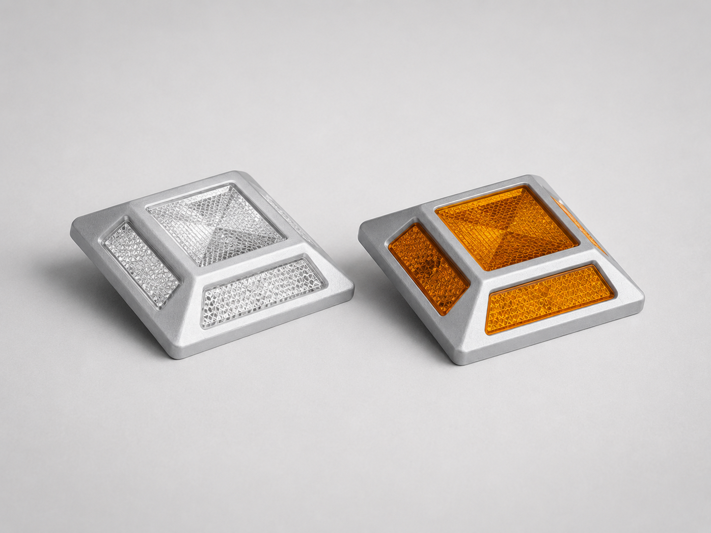 Reflective silver and amber road studs